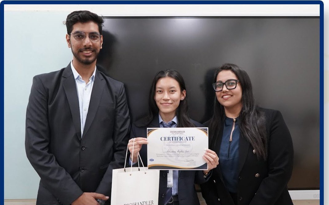 A student receiving her certificate from the trainers